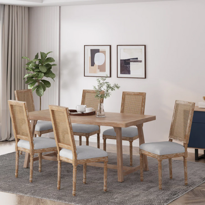 Set of 6 French country dining chairs with natural wood frames, handwoven cane backs, and light grey upholstered seats, featuring fluted legs and classic rustic charm.

