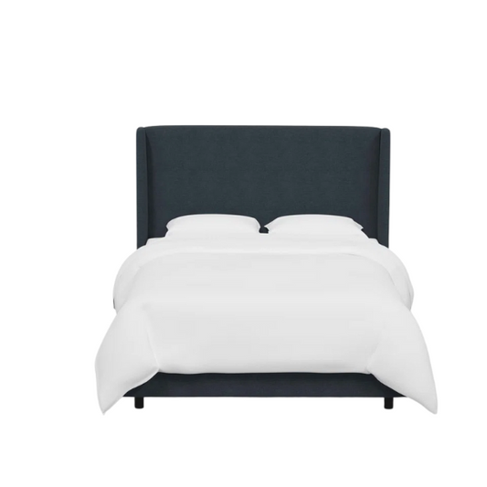 Navy blue king-size upholstered bed in linen fabric with wingback headboard and low-profile black metal legs.

