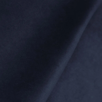 Navy blue king-size upholstered bed in velvet fabric with wingback headboard and low-profile black metal legs.

