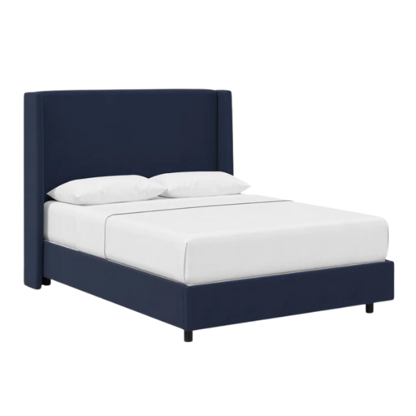 Navy blue king-size upholstered bed in velvet fabric with wingback headboard and low-profile black metal legs.

