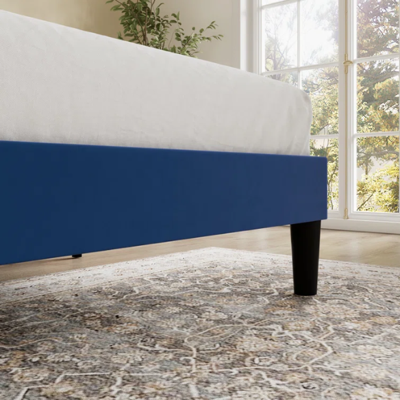 Navy blue velvet queen bed with tufted wingback headboard, 8-inch underbed clearance, and a solid wood frame.

