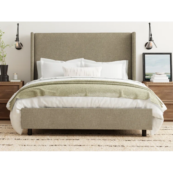 Neutral tan king-size upholstered bed in linen fabric with wingback headboard and black metal legs.

