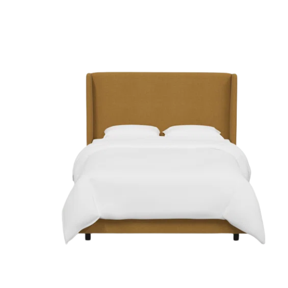 Ochre king-size upholstered bed in linen fabric with wingback headboard and low-profile black metal legs.

