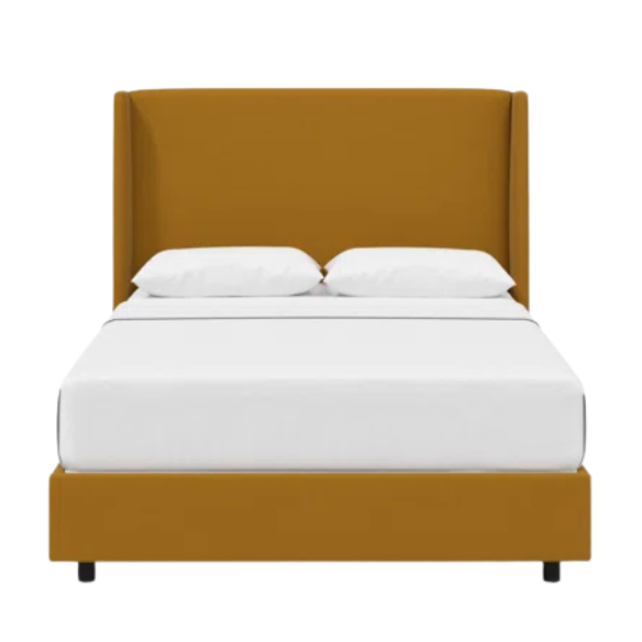 Ochre king-size upholstered bed in linen fabric with wingback headboard and low-profile black metal legs.

