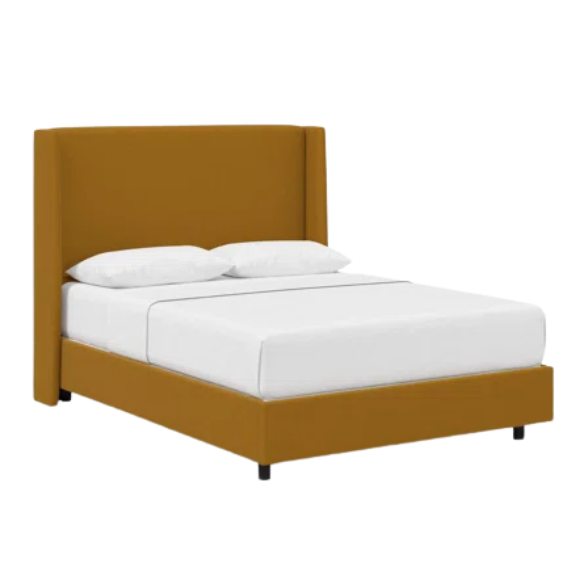 Ochre king-size upholstered bed in linen fabric with wingback headboard and low-profile black metal legs.

