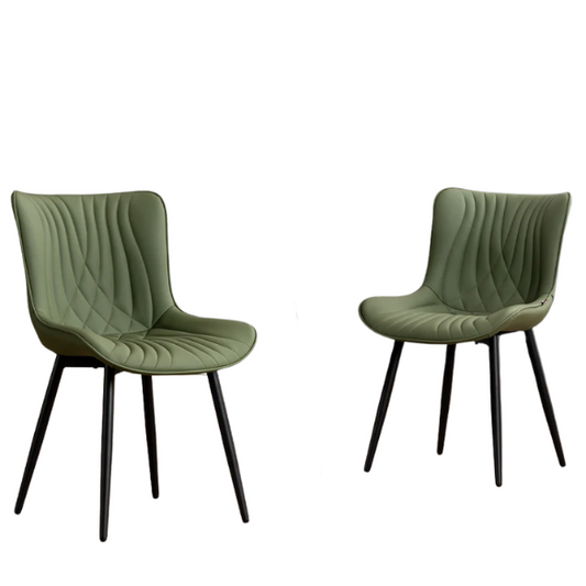 Set of 2 olive drab green faux leather dining chairs with fishtail backrest and metal legs, styled for a modern and mid-century inspired interior.

