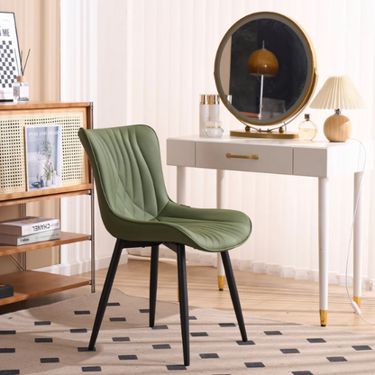 Set of 2 olive drab green faux leather dining chairs with fishtail backrest and metal legs, styled for a modern and mid-century inspired interior.

