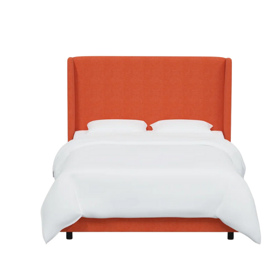 Orange king-size upholstered bed in linen fabric with wingback headboard and low-profile black metal legs.

