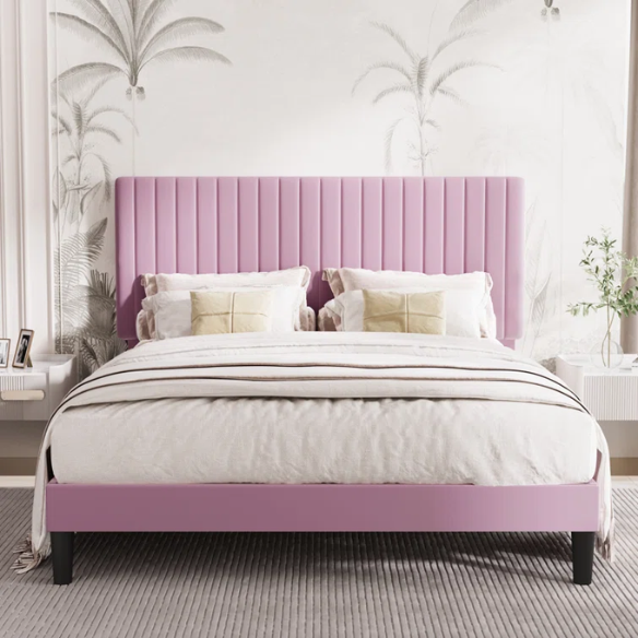 Pink velvet upholstered queen bed with tufted rectangular headboard and low-profile frame.

