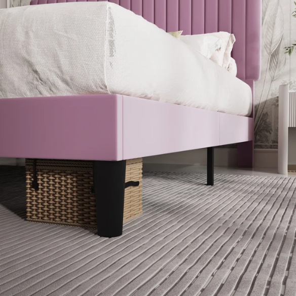 Pink velvet upholstered queen bed with tufted rectangular headboard and low-profile frame.

