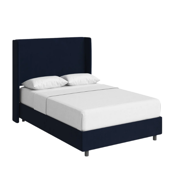 Royal blue king-size upholstered bed in velvet fabric with wingback headboard and low-profile black metal legs.

