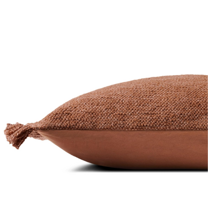 Rust-colored rectangular lumbar throw pillow with fringe trim, 13x21 inches, featuring a cotton-polyester-rayon cover and plush polyester fill—ideal for modern or boho home décor.

