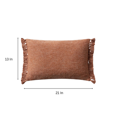Rust-colored rectangular lumbar throw pillow with fringe trim, 13x21 inches, featuring a cotton-polyester-rayon cover and plush polyester fill—ideal for modern or boho home décor.

