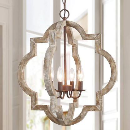 Rustic distressed wood and iron quatrefoil chandelier with candle-style lights and adjustable chain, ideal for farmhouse or French country interiors.

