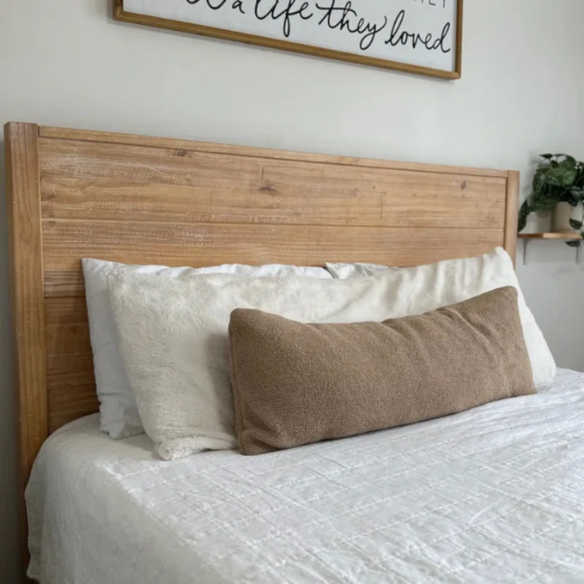 Rustic tan queen size solid wood bed frame with distressed plank headboard and sturdy pine construction