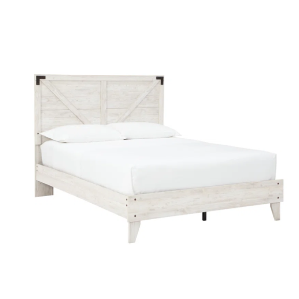 Rustic white platform bed with a distressed finish, crossbuck headboard, and metal support slats, styled in a cozy farmhouse bedroom.

