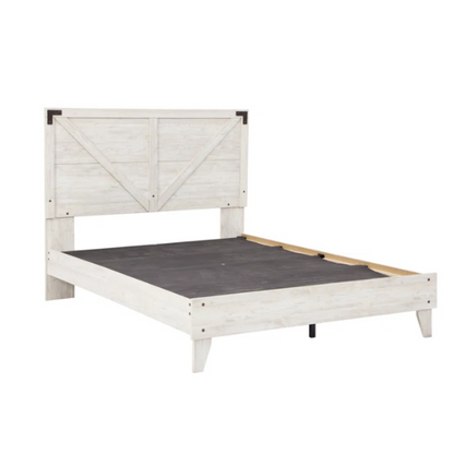 Rustic white platform bed with a distressed finish, crossbuck headboard, and metal support slats, styled in a cozy farmhouse bedroom.

