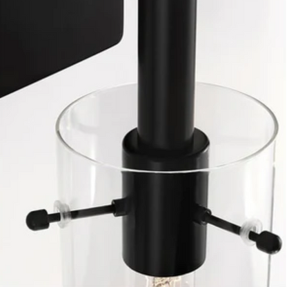 Set of 2 black wall sconces with hand-blown glass cylinder shades and bronze hardware, mountable up or down for modern or farmhouse interiors

