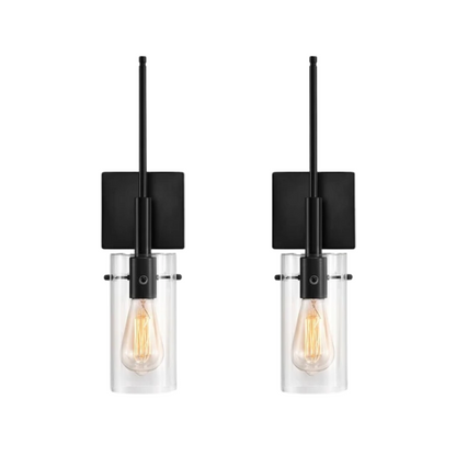 Set of 2 black wall sconces with hand-blown glass cylinder shades and bronze hardware, mountable up or down for modern or farmhouse interiors

