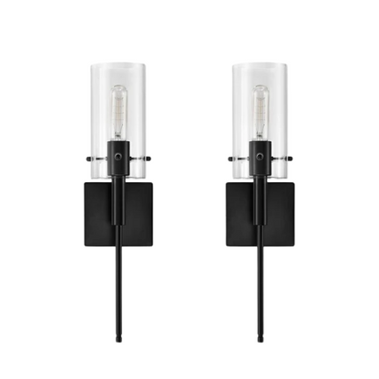 Set of 2 black wall sconces with hand-blown glass cylinder shades and bronze hardware, mountable up or down for modern or farmhouse interiors

