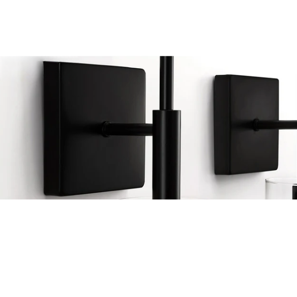 Set of 2 black wall sconces with hand-blown glass cylinder shades and bronze hardware, mountable up or down for modern or farmhouse interiors

