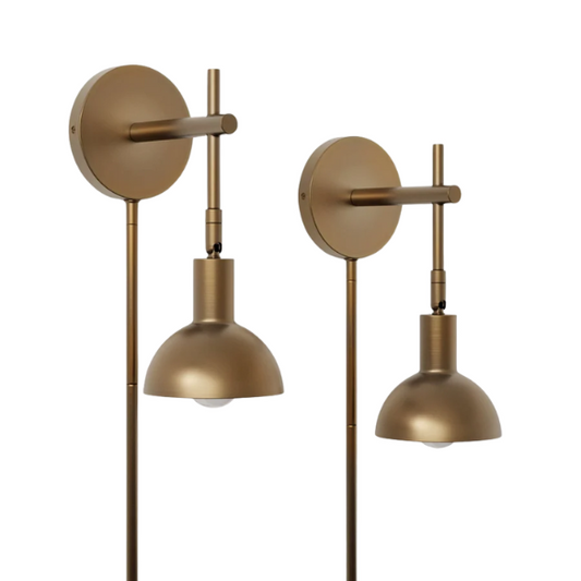 Set of 2 brass plug-in wall sconces with adjustable arms, bell-shaped metal shades, and inline switches—ideal for bedside or task lighting in modern interiors

