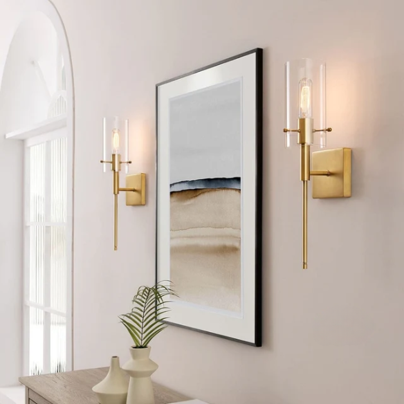 Set of 2 gold wall sconces with clear hand-blown glass cylinder shades and bronze thumbscrews, mountable up or down for modern and farmhouse interiors

