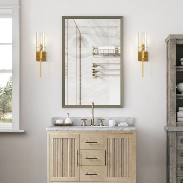 Set of 2 gold wall sconces with clear hand-blown glass cylinder shades and bronze thumbscrews, mountable up or down for modern and farmhouse interiors

