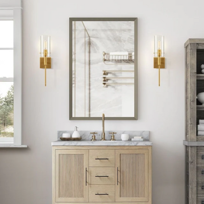 Set of 2 gold wall sconces with clear hand-blown glass cylinder shades and bronze thumbscrews, mountable up or down for modern and farmhouse interiors

