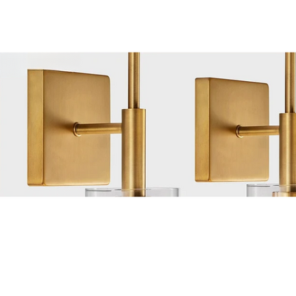 Set of 2 gold wall sconces with clear hand-blown glass cylinder shades and bronze thumbscrews, mountable up or down for modern and farmhouse interiors

