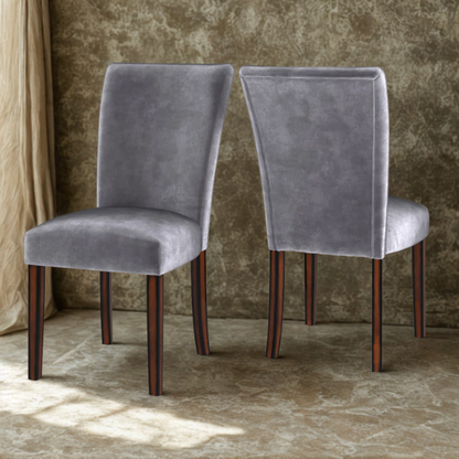 Set of 2 Parson-style dining chairs upholstered in sleek grey velvet with espresso-finished wood legs and plush high backs, ideal for modern or traditional dining spaces.

