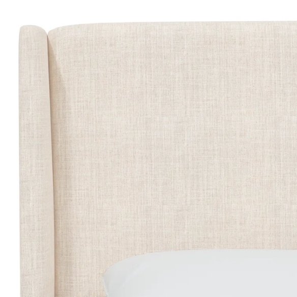Talc king-size upholstered bed in linen fabric with wingback headboard and low-profile black metal legs.


