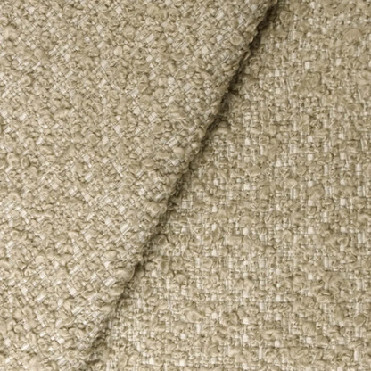 Tan king-size upholstered bed in bouclé fabric with wingback headboard and low-profile black metal legs.

