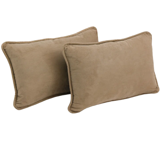 Set of 2 taupe microsuede lumbar throw pillows with piped edges on modern sofa