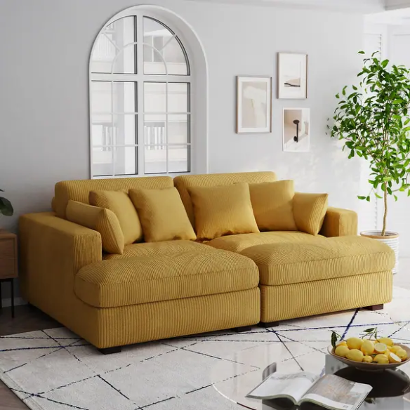 Warm golden yellow corduroy convertible sleeper sofa with adjustable headrest and twin-size pullout functionality, includes two matching toss pillows