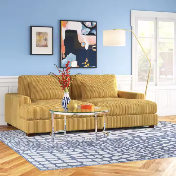 Warm golden yellow corduroy convertible sleeper sofa with adjustable headrest and twin-size pullout functionality, includes two matching toss pillows