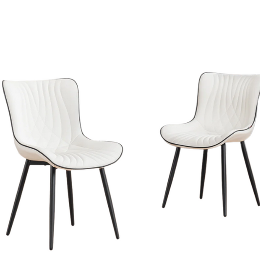 Set of 2 modern dining chairs with white faux leather upholstery and black metal fishtail-style backs, perfect for contemporary kitchens and dining rooms.

