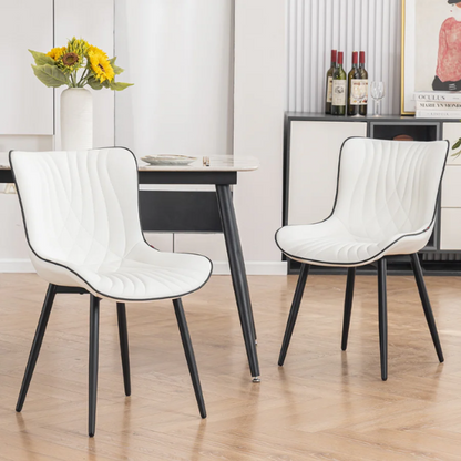 Set of 2 modern dining chairs with white faux leather upholstery and black metal fishtail-style backs, perfect for contemporary kitchens and dining rooms.

