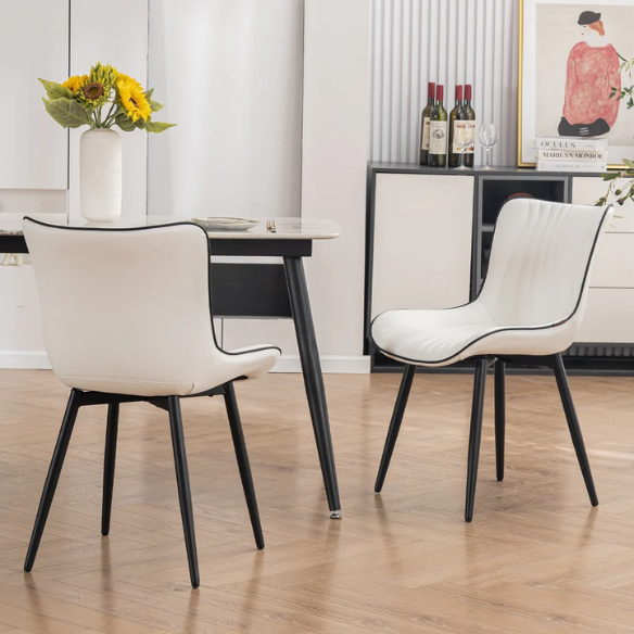 Set of 2 modern dining chairs with white faux leather upholstery and black metal fishtail-style backs, perfect for contemporary kitchens and dining rooms.

