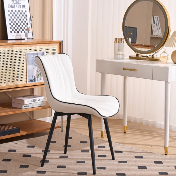 Set of 2 modern dining chairs with white faux leather upholstery and black metal fishtail-style backs, perfect for contemporary kitchens and dining rooms.

