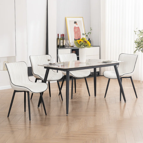 Set of 2 modern dining chairs with white faux leather upholstery and black metal fishtail-style backs, perfect for contemporary kitchens and dining rooms.

