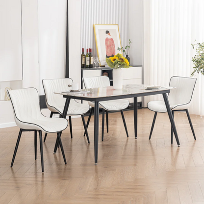 Set of 2 modern dining chairs with white faux leather upholstery and black metal fishtail-style backs, perfect for contemporary kitchens and dining rooms.

