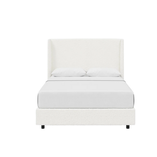 White king-size upholstered bed in bouclé fabric with wingback headboard and low-profile black metal legs.

