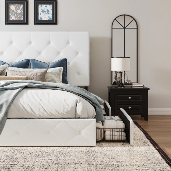 White faux leather queen bed with diamond-tufted adjustable headboard and four underbed storage drawers.

