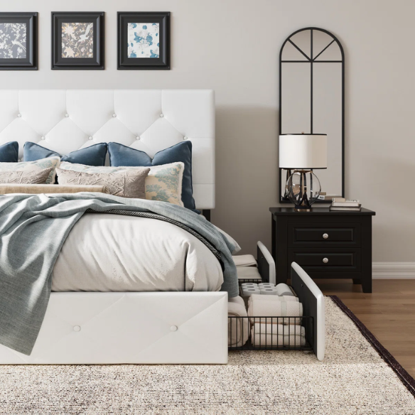 White faux leather queen bed with diamond-tufted adjustable headboard and four underbed storage drawers.

