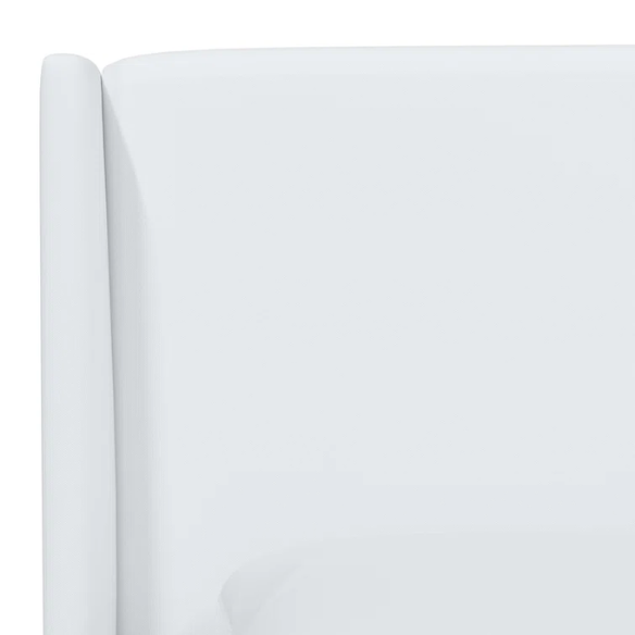 White king-size upholstered bed in twill fabric with wingback headboard and low-profile black metal legs.

