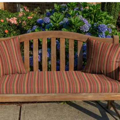 Striped accent pillow in red, brown, and gold – reversible, weather-resistant, and overstuffed with polyester fill for both indoor and outdoor use.

