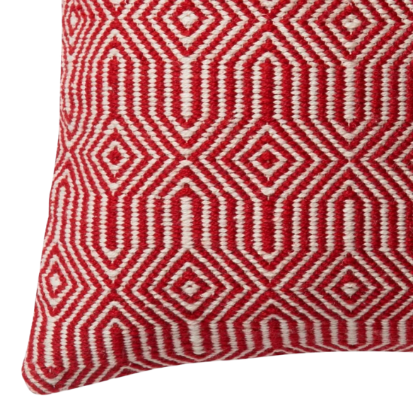 Red and cream geometric throw pillow on modern outdoor furniture with vibrant decor

