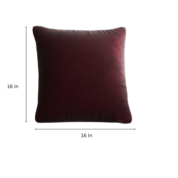 Red wine crushed velvet throw pillow, 16x16 square with soft, reversible fabric and hidden zipper, styled on a modern sofa for a sophisticated touch.

