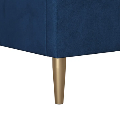 Royal blue velvet king platform bed with tufted rectangular headboard, wood slat support, and sleek low-profile design.

